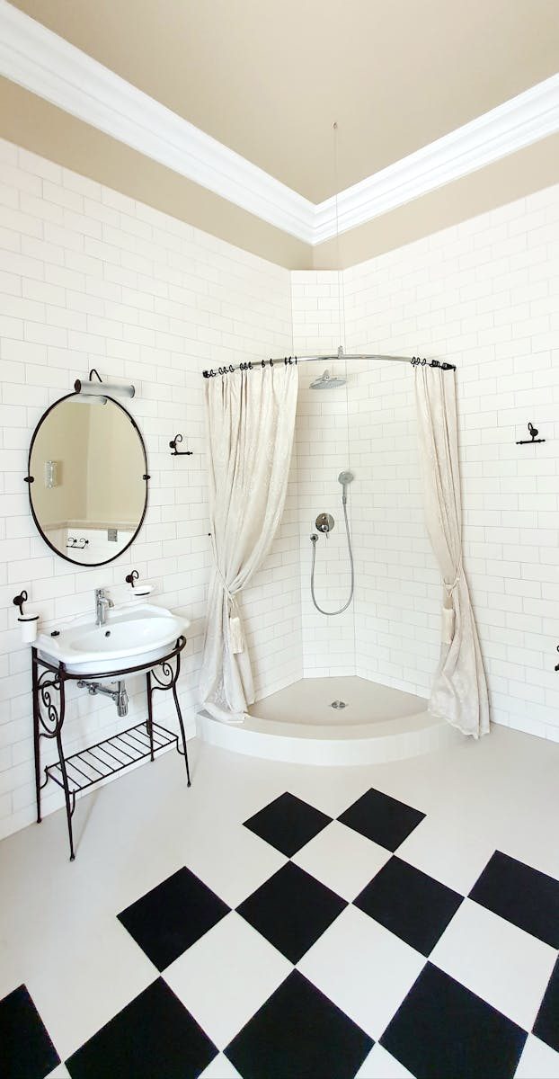 Chic bathroom with vintage style and checkered floor tiles, perfect for classic interior design.